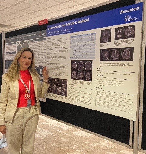 Radiology doctor standing by research board