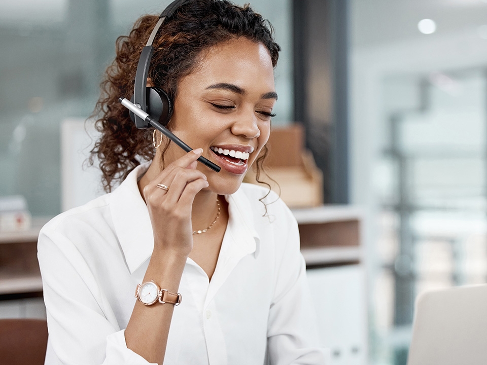 Financial counselor with headset answers call