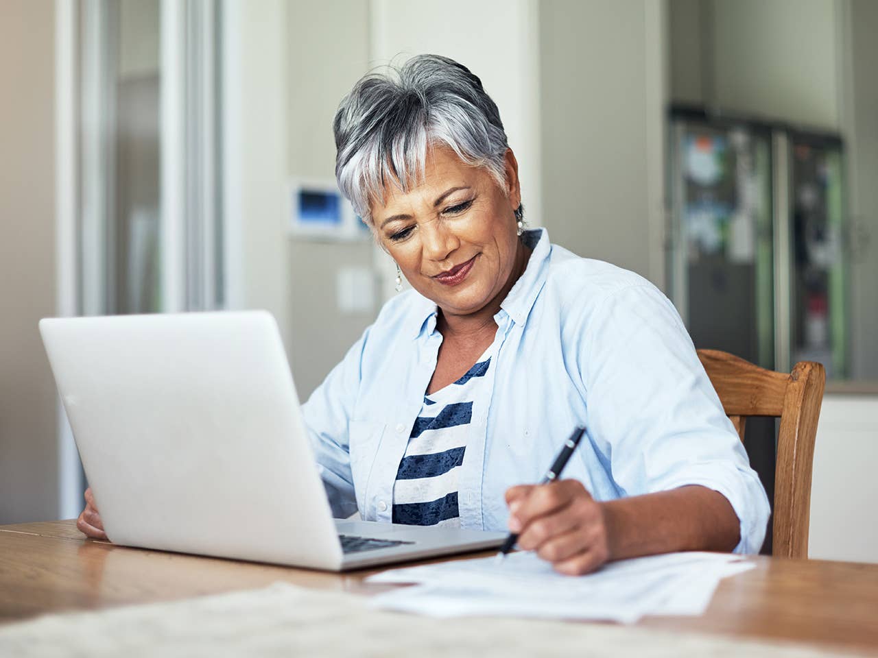 Woman on computer pays a medical bill