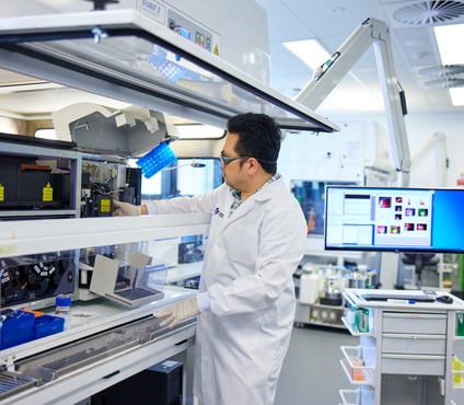 Garvan Man in lab working on equipment