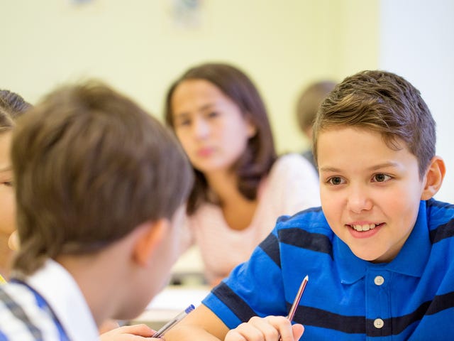 Twi boys talking to each other before their exam preparation course with Berlitz Saudi Arabia