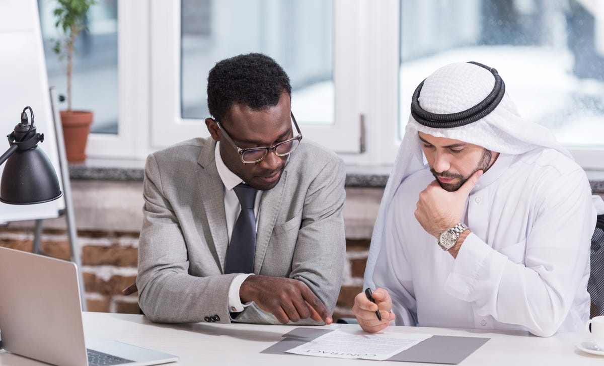 Student and instructor looking at an exercise during one of their private language lessons with Berlitz Saudi Arabia