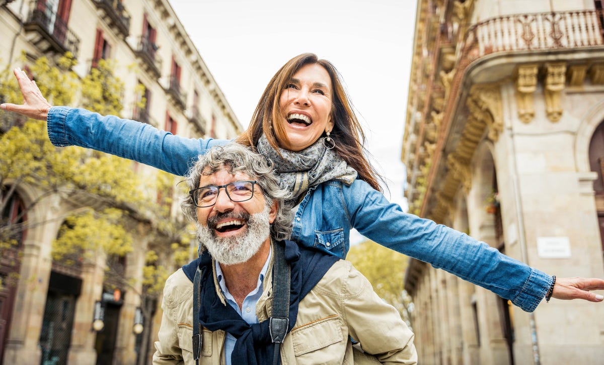 Two people abroad on a language study laughing together