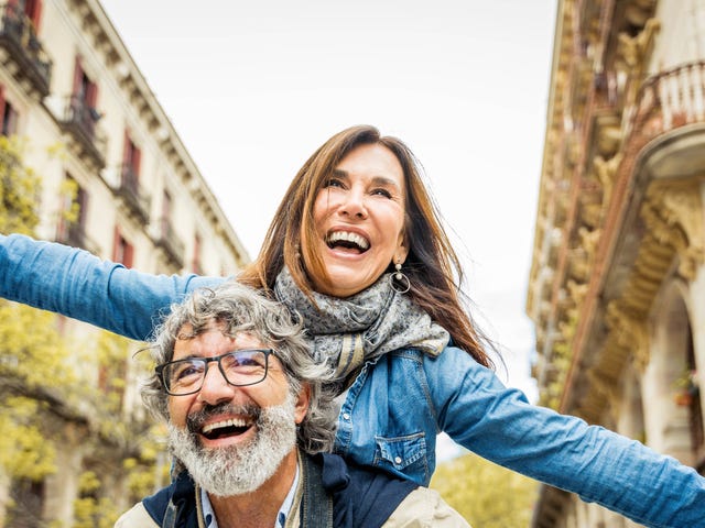 Two people abroad on a language study laughing together