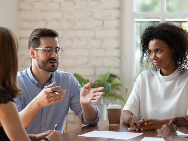 Students attending face-to-face language learning and listening to their instructor talk in a foreign language