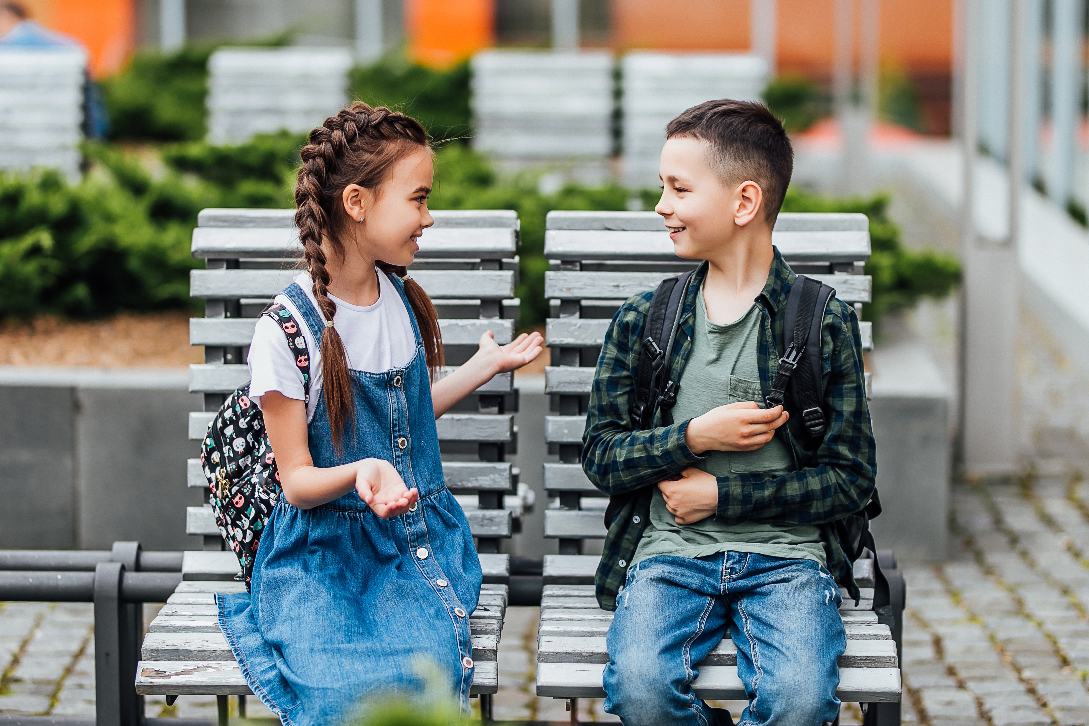 Boy and girl talking to each other happily after their semi-private language class for kids and teens with Berlitz Saudi Arabia