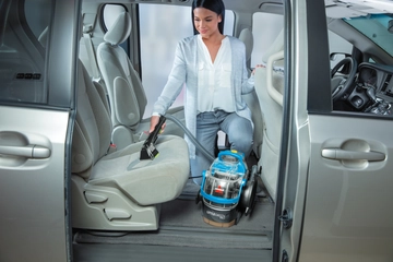 Using Pet Stain Tool to Deep Clean seat inside vehicle.