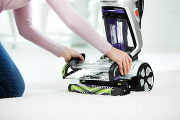 Removing Floor Nozzle to access brushes of ProHeat 2X Revolution Pet Pro Upright Carpet Cleaner.  