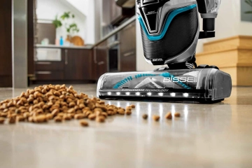 SurfaceSense Vacuum vacuuming crumbs from hard flooring. 