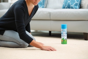 Febreze Gain Heavy Traffic Carpet Foam on area rug.