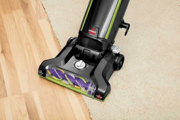 Moving CleanView Bagged Pet Vacuum from carpet to hard flooring