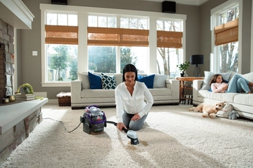 Using Pet Stain Trapper Tool to deep clean stain on carpet. 