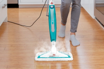 PowerFresh Pet Lift-Off Steam Mop cleaning paw prints off hard floor.