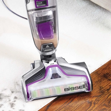 CrossWave Pet Pro Wet Dry Vac moving from area rug to hard flooring 