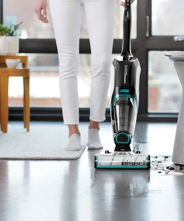 CrossWave Cordless Max Multi-Surface Wet Dry Vac mopping and vacuuming spilled mess on tile flooring