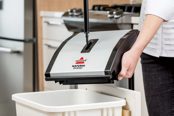 Natural Sweep Manual Sweeper being easily emptied