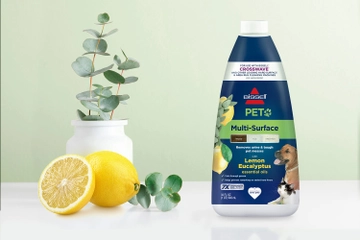 Bottle of PET Multi-Surface Lemon Eucalyptus formula bottle surrounded by lemons