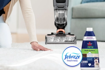 Running hand across dry carpet with bottle of Pet Multi-Surface with Febreze formula bottle and Febreze Logo
