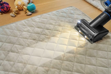 Using PowerClean FurGuard FurFinder tool to vacuum hair from upholstery