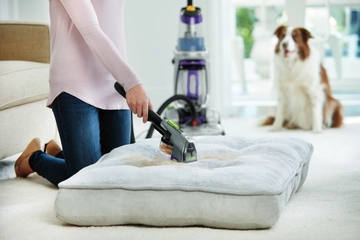 Using Attachment on end of hose of ProHeat 2X Revolution Pet Pro Carpet Cleaner to deep clean pet bed.