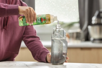 Pouring Apple Spice Formula into Solution Tank