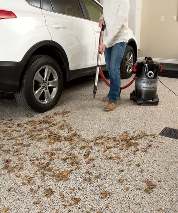 Using blower function of MultiClean Wet Dry Vac to blow leaves out of garage.