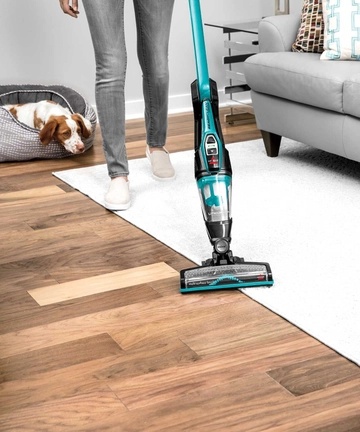 ReadyClean Cordless Stick Vac switching from area rug to hard flooring