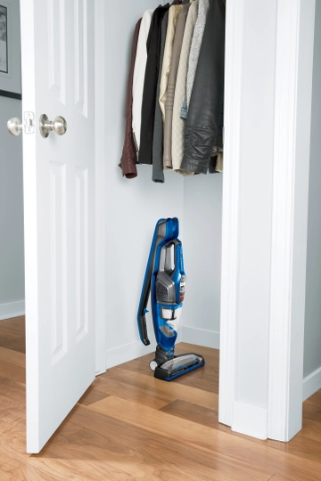 ReadyClean Cordless Stick Vac Handle Folded and machine stored in closet