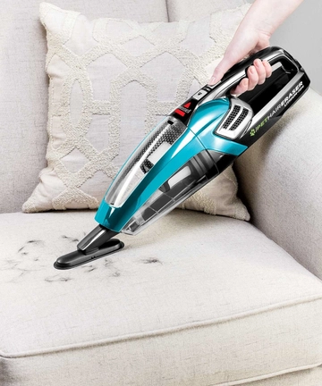 Using Dusting Brush on Pet Hair Eraser Hand Vac to vacuum couch
