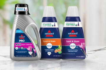Upright and 2 Portable Febreze Formula Bottles