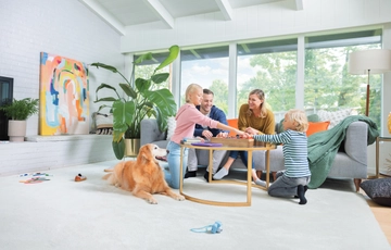Family and Dog in Living Area.