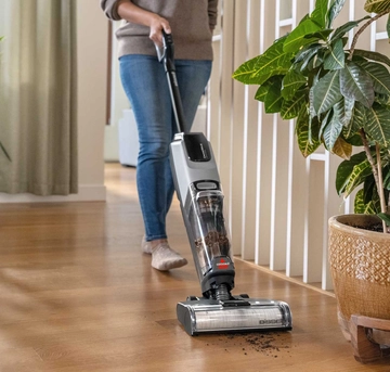 CrossWave OmniForce All-in-One Multi-Surface Cleaner vacuuming dirt from hard flooring
