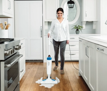 PowerFresh Steam Mop Mopping Spill on kitchen flooring.