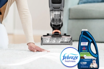 Running hand across dry carpet with bottle of Pet Multi-Surface with Febreze formula bottle and Febreze Logo