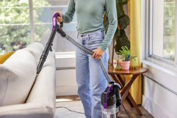 CleanView Compact using hose to vacuum furniture
