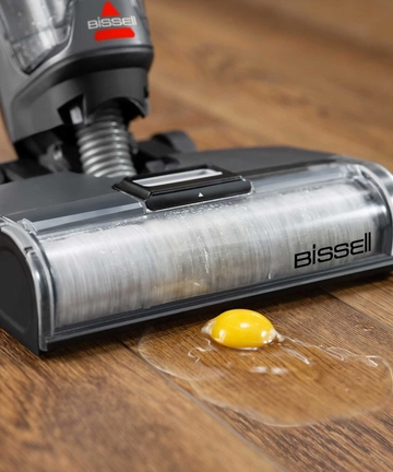 CrossWave OmniForce All-in-One Multi-Surface Cleaner vacuuming egg from hard flooring