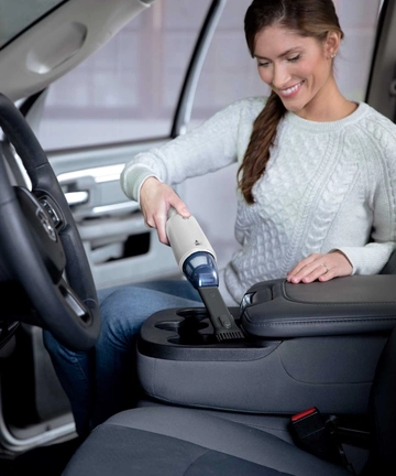 TurboSlim Hand Vac vacuuming car interior