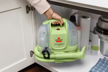 Little Green Mini Portable Carpet Cleaner in storage