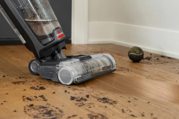BISSELL® CrossWave mopping and vacuuming mud from hard flooring