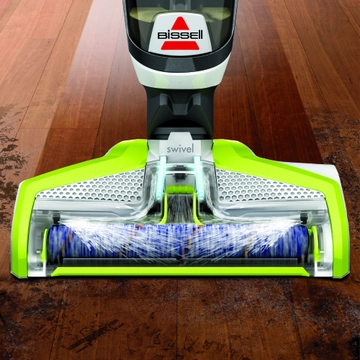 CrossWave Wet Dry Vac Foot spraying water and solution on to hard flooring