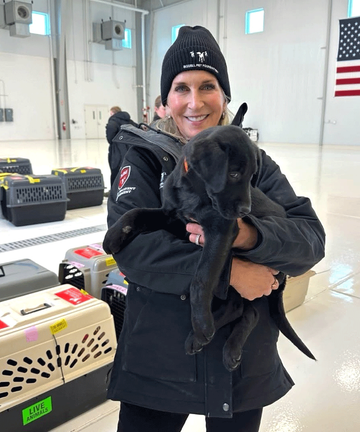 Cathy with dog inside transport center