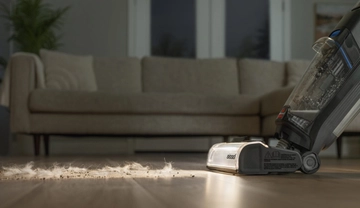 Using headlights on CrossWave OmniFind to vacuum hair and dirt from hard flooring.