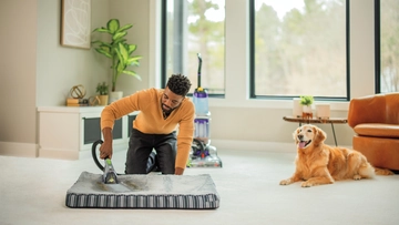 Using Tool on end of hose of ProHeat 2X Revolution Pet Carpet Cleaner to deep clean pet bed. 