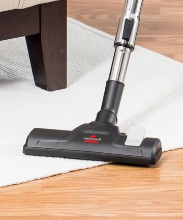 Nozzle of Zing Bagged Canister Vacuum with switch.