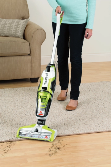 CrossWave Wet Dry Vac moving from area rug to hard flooring.