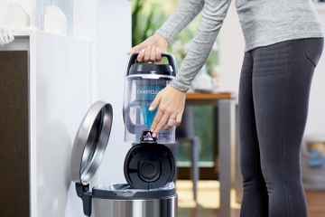 Emptying Dirt Bin into Trash