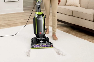 Vacuuming dirt from carpet