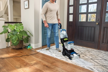  Using TurboClean DualPro Pet Carpet Cleaner to deep clean area rug in entry way.