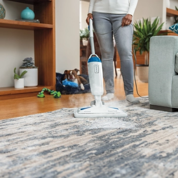 Using Carpet Glider on foot of PowerFresh Steam Mop to refresh area rug.