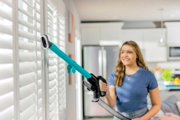 Using Extension Wand on Hose to vacuum above flooring.